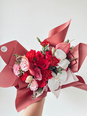 (With Phalaenopsis) Elysia- 12 stalks mixed dark Shocking Pink roses & Red Carnations